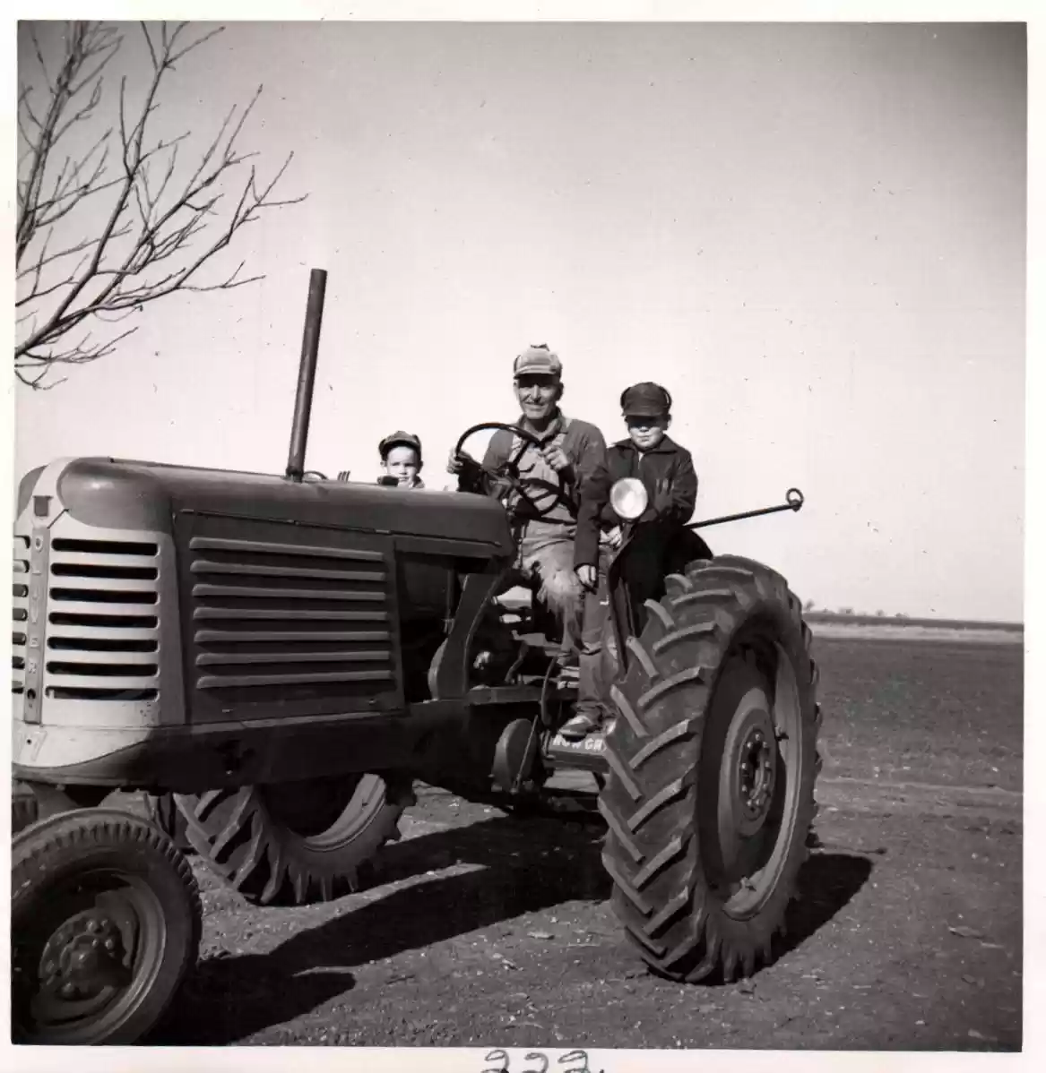 222 - man and boys on tractor